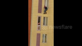 Kazakh man hangs from fifth floor window to escape family argument