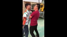 Two Chinese men fight in a very bizarre way