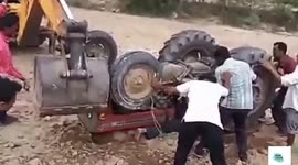 Indian farmer has a 'near death' after getting partially crushed by his tractor