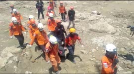 Rescuers retrieve bodies from the area as death toll passes 1,400 in Palu, Indonesia