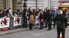 Olga Kurylenko singing autographs to fan at Johnny English Strike Again film premiere