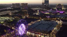 Drone flight over Ferris Wheel and shopping center