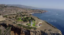 Aerial view of a lighthouse on a cliff