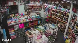 Grandfather, 60, fights off two knife raiders who tried to steal 'everything' from his shop's till