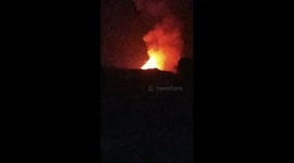 Sky lights up during volcanic lava eruptions in Indonesia