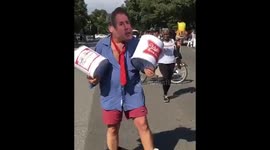 Man touts beer kegs, wears pants around ankles to poke fun at Kavanaugh during DC protests