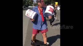 Man touts beer kegs, wears pants around ankles to poke fun at Kavanaugh during DC protests