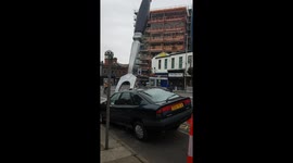 Giant fork through a car