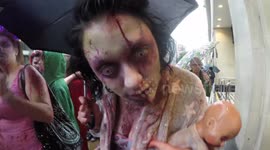Zombies walk through the streets of London for charity