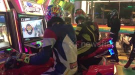 Real-life motorbike riders try out arcade versions