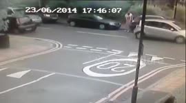 CCTV captures the moment cyclist clips toddler and father crossing road