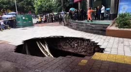Huge sinkhole swallows up passersby on street in China