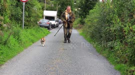 A photographer and his dog running to catch a story.