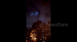 Mysterious blue lights move in flying wheel formation over Moscow