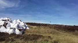 Helicopter Clearing Strips Of Moorland Heather