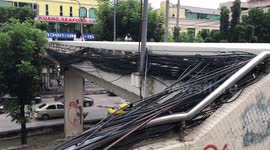 Shocking mess of cables along a motorway bridge