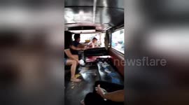 Angry wife catches husband and mistress on bus