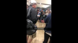 Woman is deplaned with baby squirrel