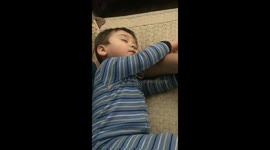 Adorable sleepy one year old won't let go of his dad