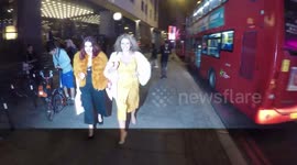 Nadia Sawalha poses for photographers, jokes that her bra's been