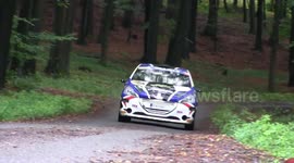 RALLY CAR CRASHES INTO TREE LOGS