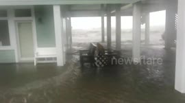 Waves break land, flooding residential area in Florida