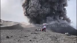 Russian tourists watch stunning volcanic eruption from only a few steps away