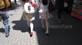 Trendy kitty lady in Tokyo.