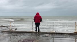 Someone plays chicken with the waves during Storm Callum.