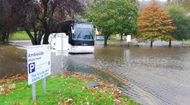 Bus braves flood water in Lake District car park