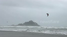 Ocean high! Kite surfers make most of gale-force winds in front of iconic St Michael's Mount