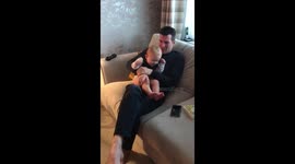 One year old finding it funny grinding his teeth