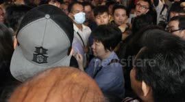 Occupy Central protestors kettle a woman in Hong Kong