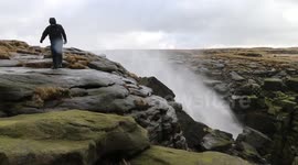Waterfall blown backwards by high winds