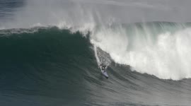 Surfers in Portugal ride season's first big swell hours before Storm Leslie makes landfall