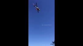 Helicopter picks up water to fight growing Masonic Fire