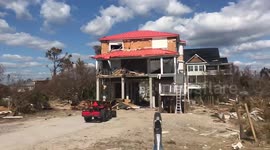 Man drives through wreckage after Hurricane Michael at Mexico beach
