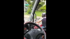 Pillion passenger wears helmet the wrong way round