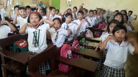 Primary school children give teacher a very enthusiastic morning greeting