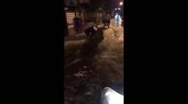 Lads go wakeboarding on flooded road after monsoon rains