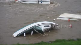 Capsized boat floats on side in Welsh harbour after Storm Callum