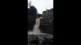 Adrenaline junkie flings self down waterfall during UK floods