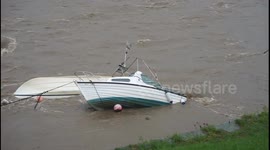 Capsized boat floats on side in Welsh harbour after Storm Callum