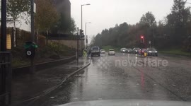 Man drying pavement in storm Callum