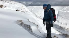 Mountaineer forward diving into the snow slowmo style
