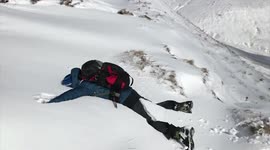 Mountain walker diving in thick snow