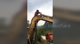 Man tries to fix broken digger with tape