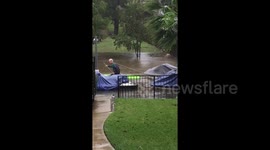 Resident kayaks through waterlogged street to rescue neighbor's boat as severe flooding hits Central Texas