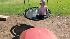 Ingenious father backs up lawn mower to push daughter on swing