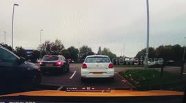 Woman pulls out at roundabout